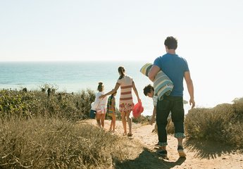 Family walking to the beach