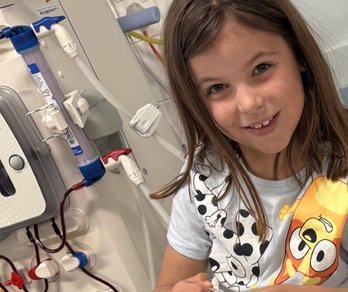 Child in hospital receiving haemodialysis treatment