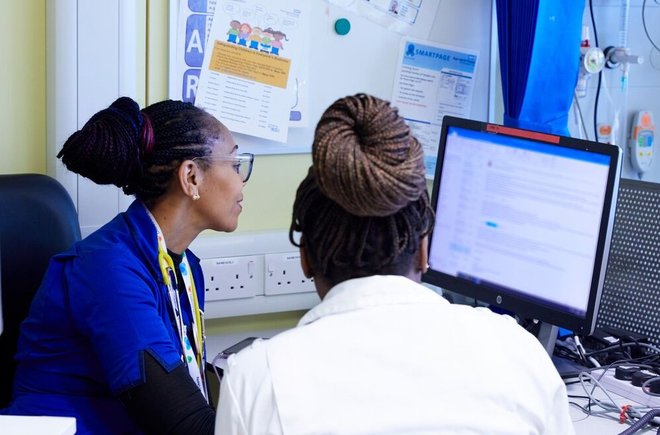 Nurses at a computer in a hospital