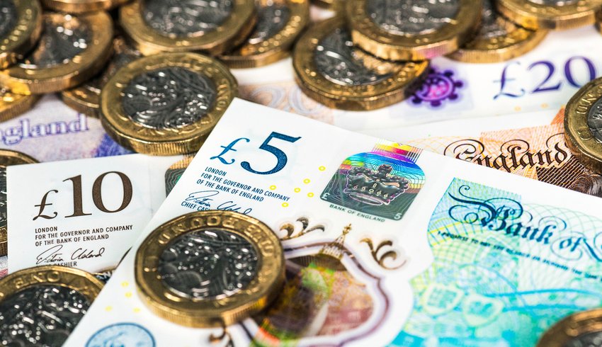 Various British sterling cash notes and coins.