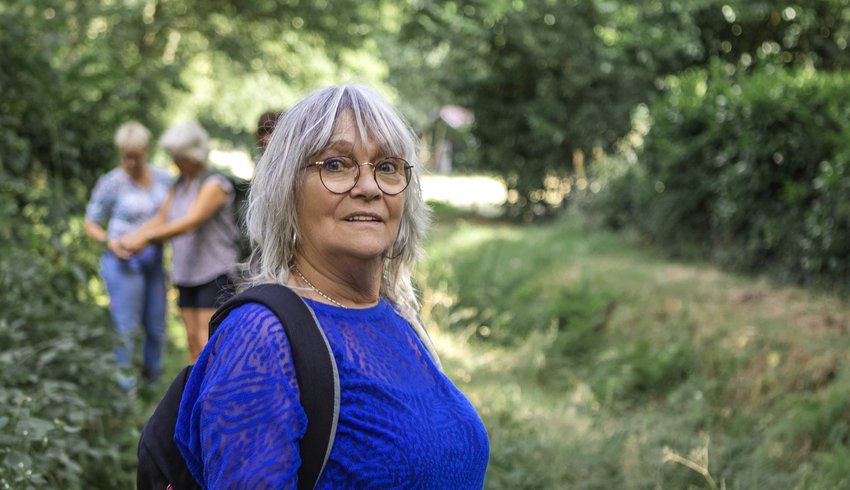 A woman out on a walk with her family.